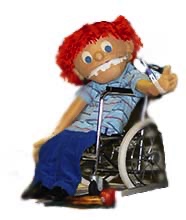 Howard the Puppet seated in a wheelchair.